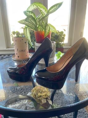 Patent platform pumps w/stiletto heel. Scuffs from rubbing in box—Never worn!